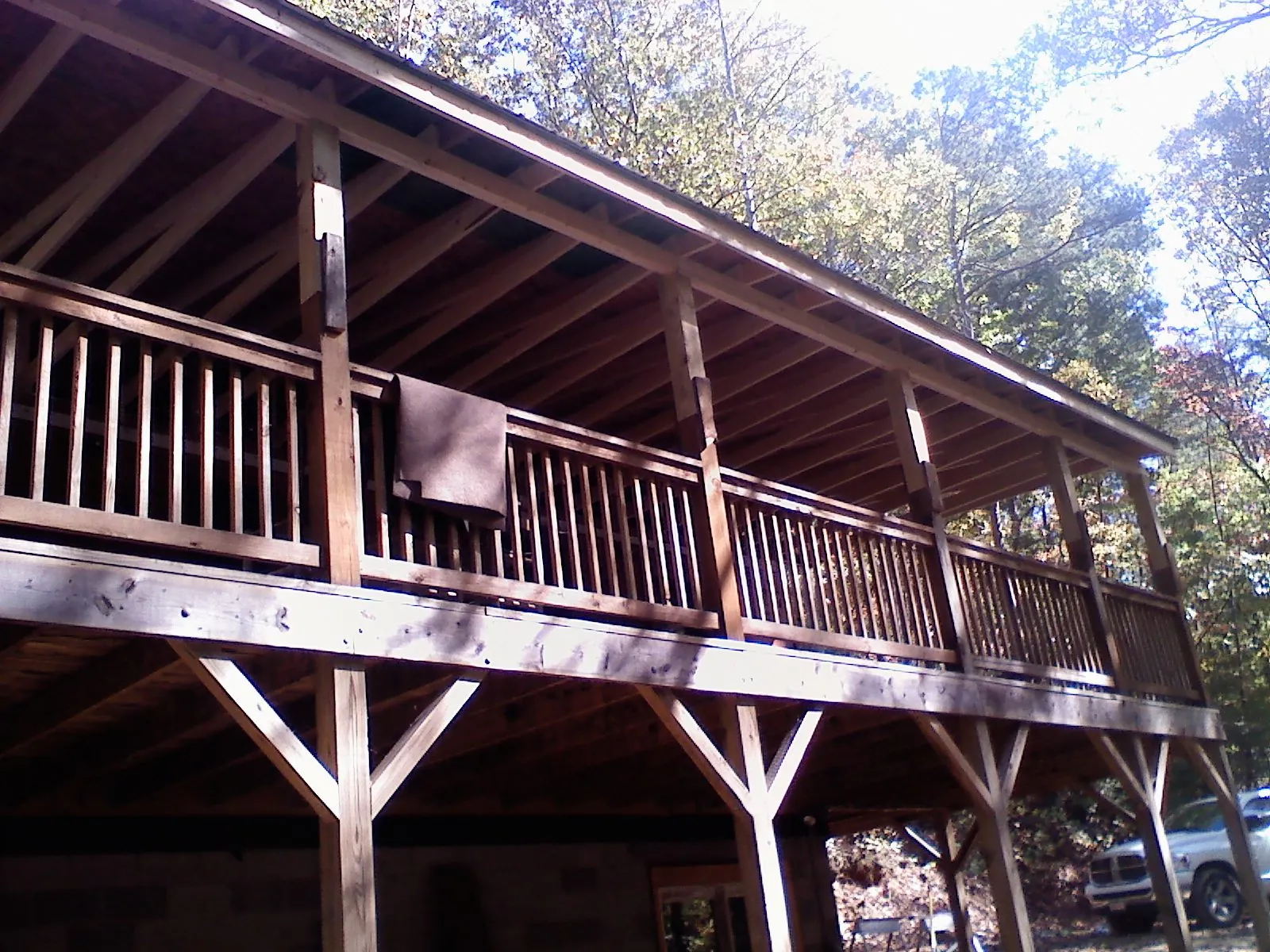 Timber framing under a new elevated porch and deck in Craigsville